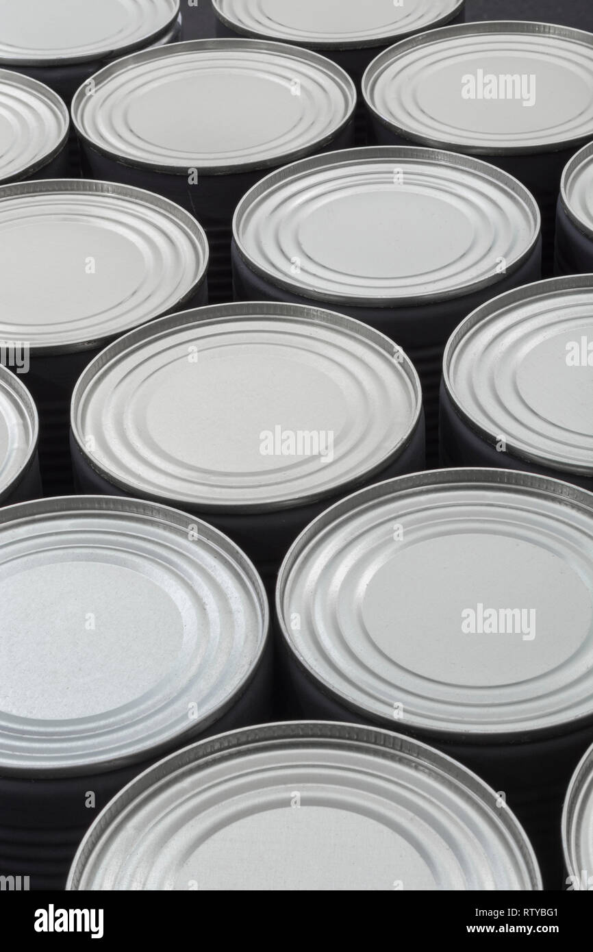 Abstract light steel food cans, tinned food. For food preservation, catering industry, food storage, Brexit stockpiling, panic buying, hoarding food. Stock Photo