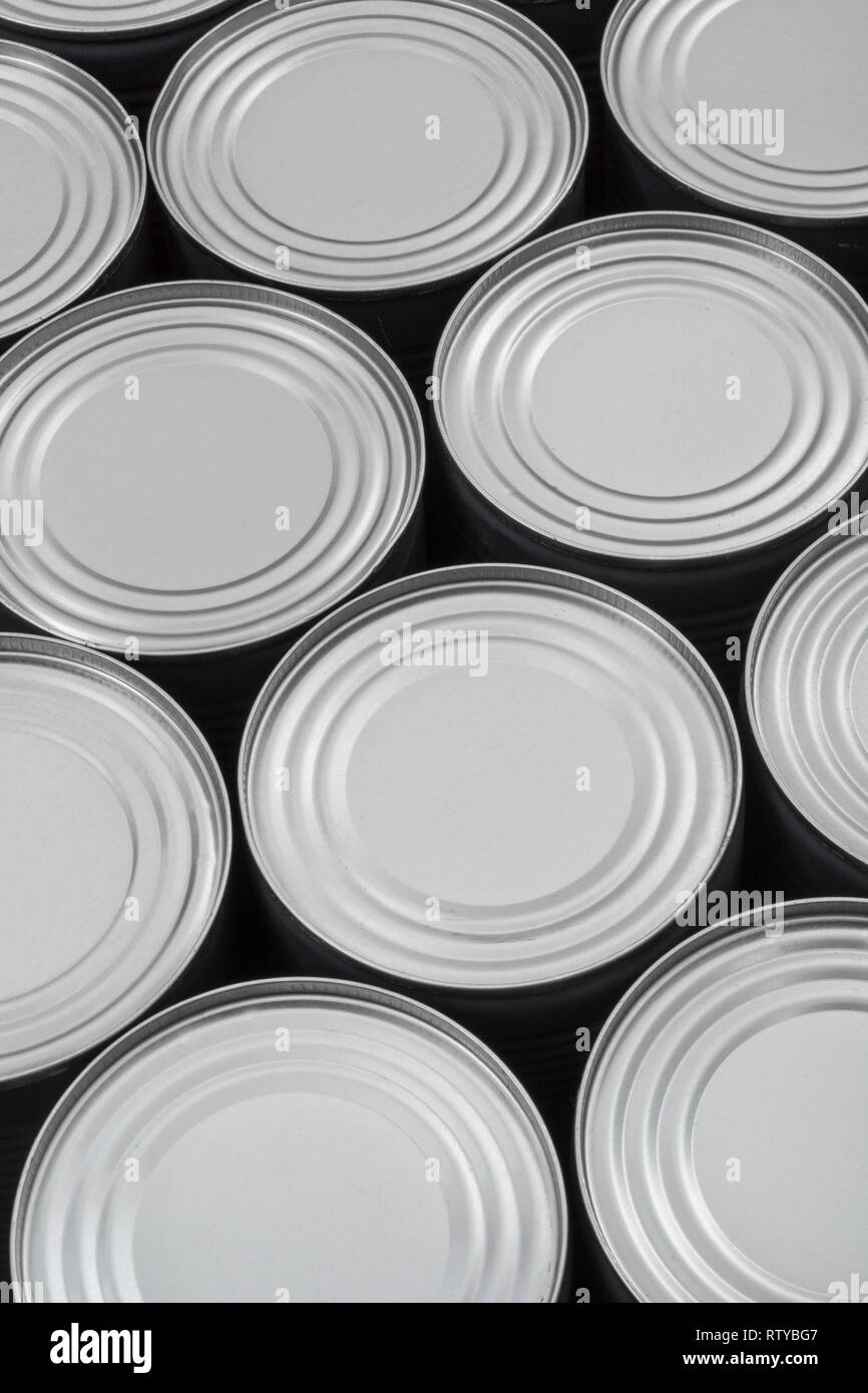 Abstract light steel food cans, tinned food. For food preservation, catering industry, food storage, Brexit stockpiling, panic buying, hoarding food. Stock Photo