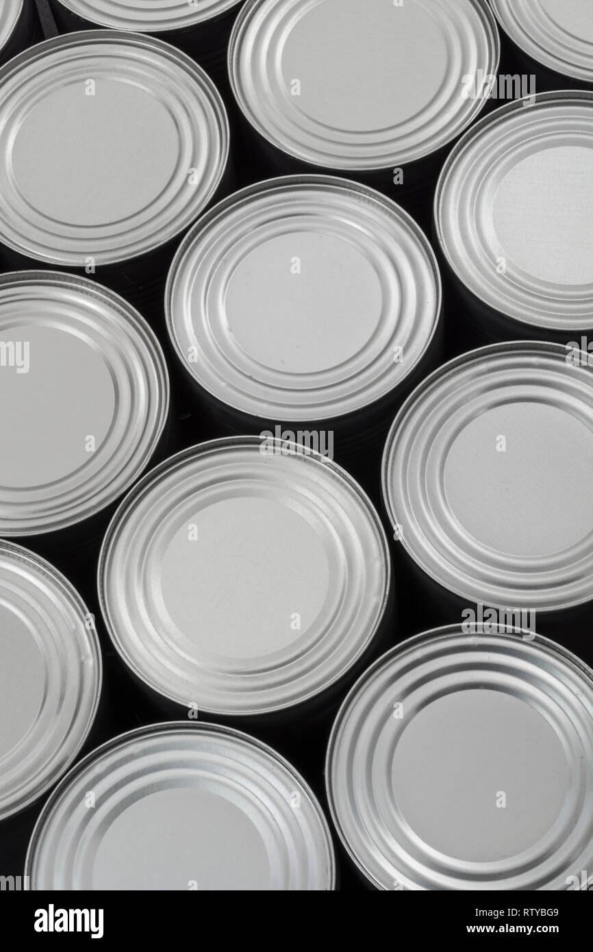 Abstract light steel food cans, tinned food. For food preservation, catering industry, food storage, Brexit stockpiling, panic buying, hoarding food. Stock Photo