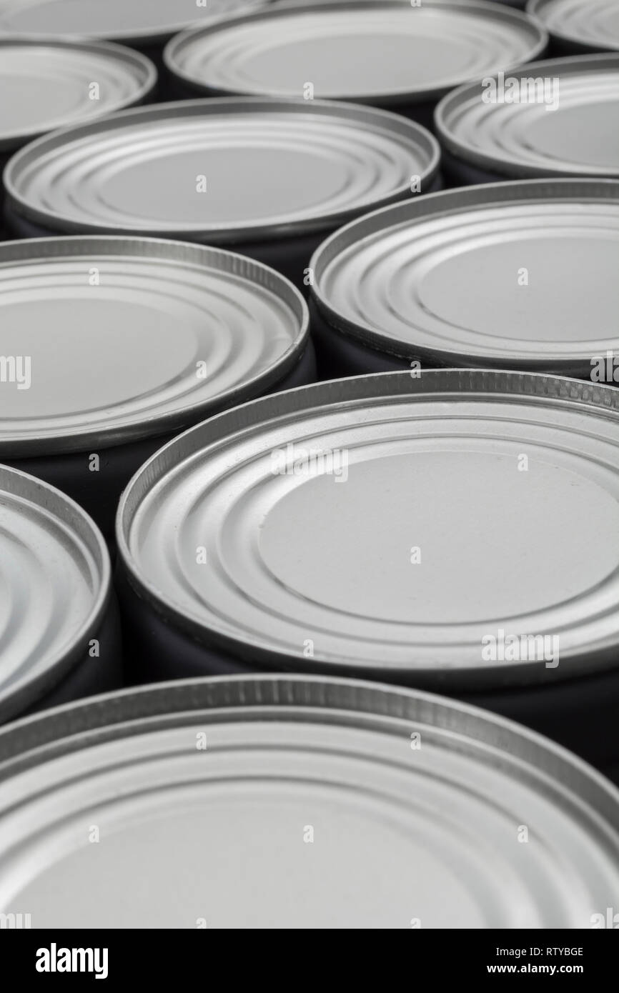 Abstract light steel food cans, tinned food. For food preservation, catering industry, food storage, Brexit stockpiling, panic buying, hoarding food. Stock Photo