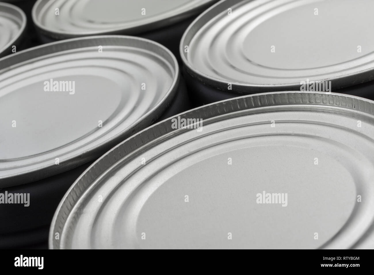 Abstract light steel food cans, tinned food. For food preservation, catering industry, food storage, Brexit stockpiling, panic buying, hoarding food. Stock Photo