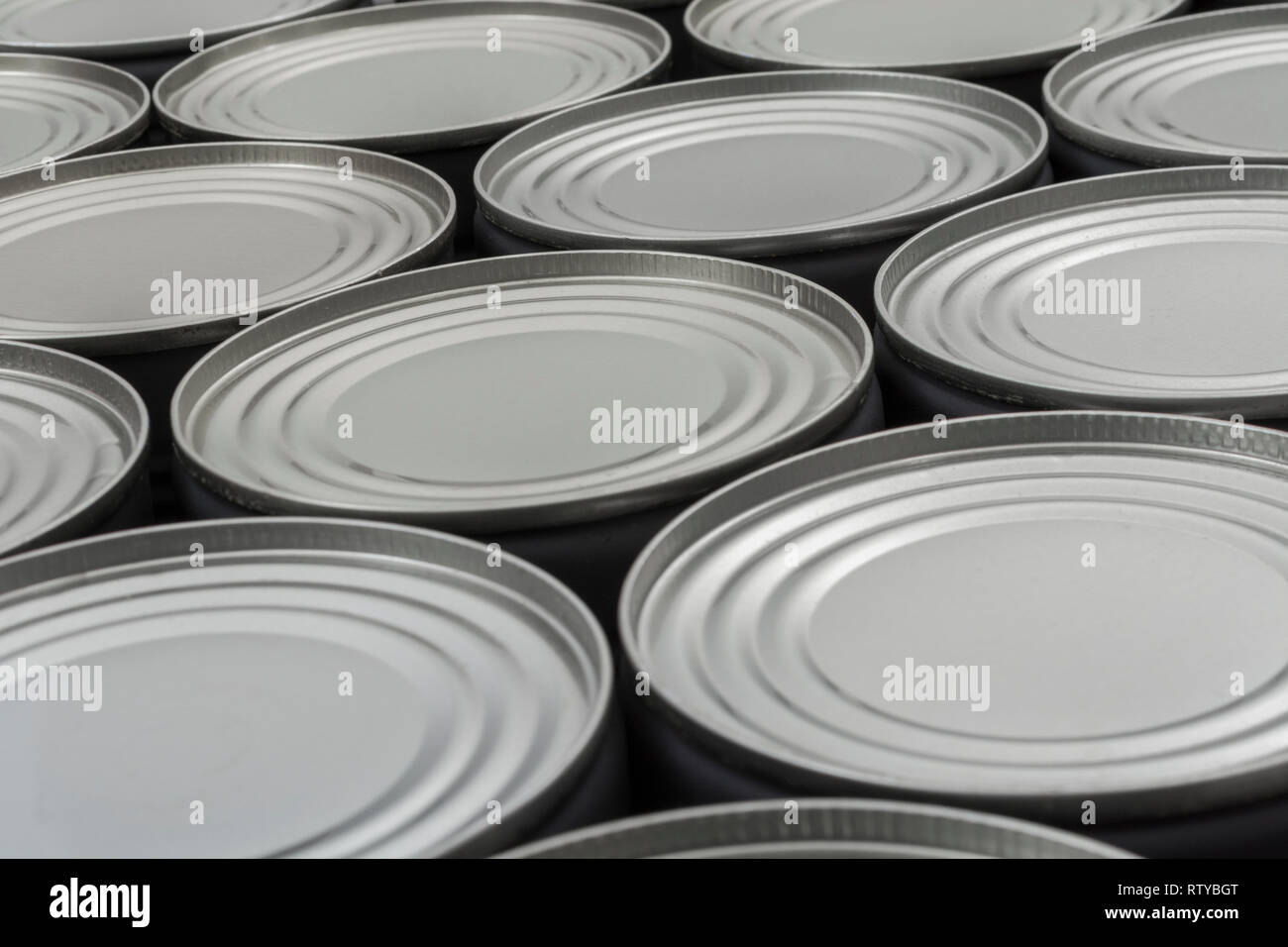 Abstract light steel food cans, tinned food. For food preservation, catering industry, food storage, Brexit stockpiling, panic buying, hoarding food. Stock Photo