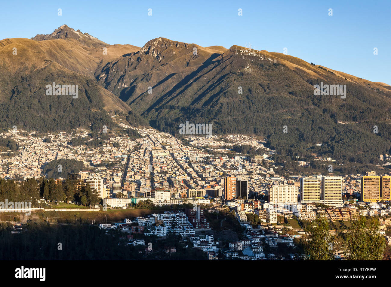 Partial view of Quito at the foot of the Pichincha volcano early in the