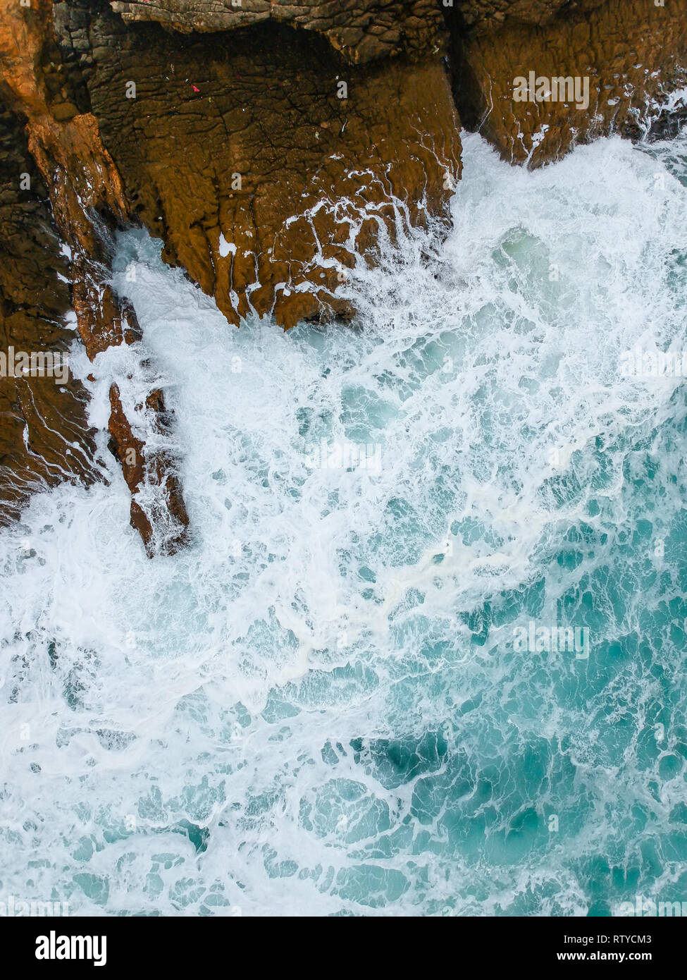Aerial view of sea waves crash on the shoreline Stock Photo - Alamy