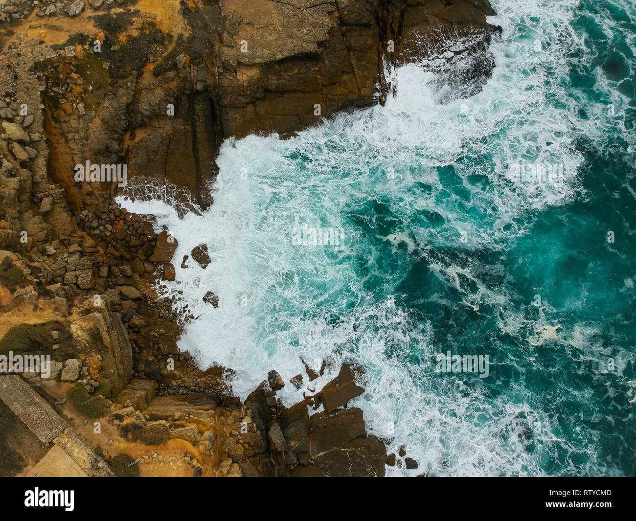 Aerial view of sea waves crash on the shoreline Stock Photo - Alamy