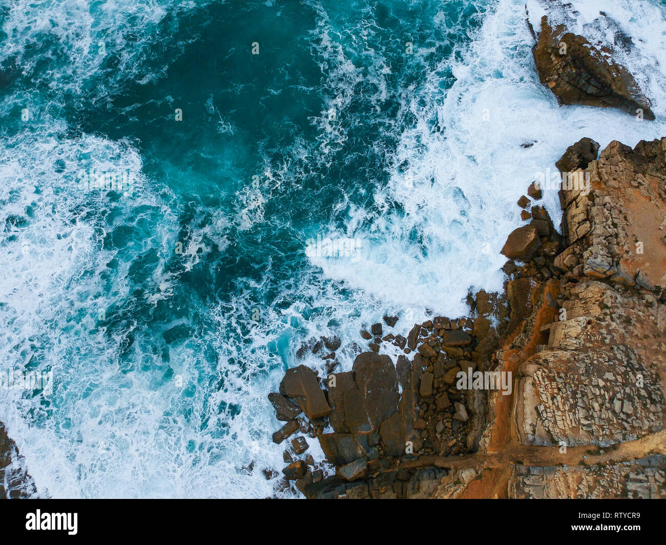 Aerial view of sea waves crash on the shoreline Stock Photo - Alamy