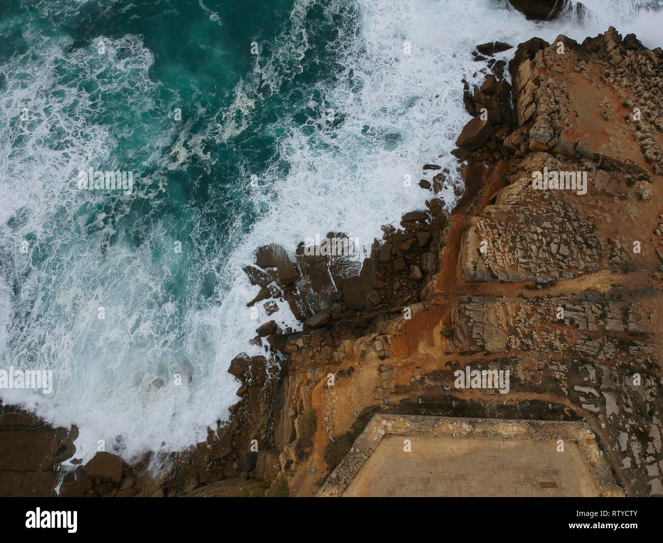 Aerial view of sea waves crash on the shoreline Stock Photo - Alamy
