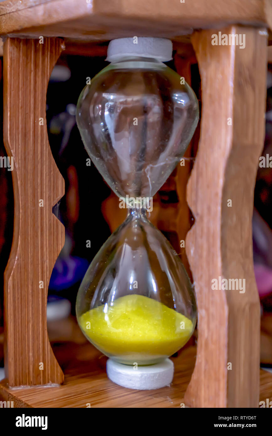 Glass hourglass, device used to measure the passage of time Stock Photo