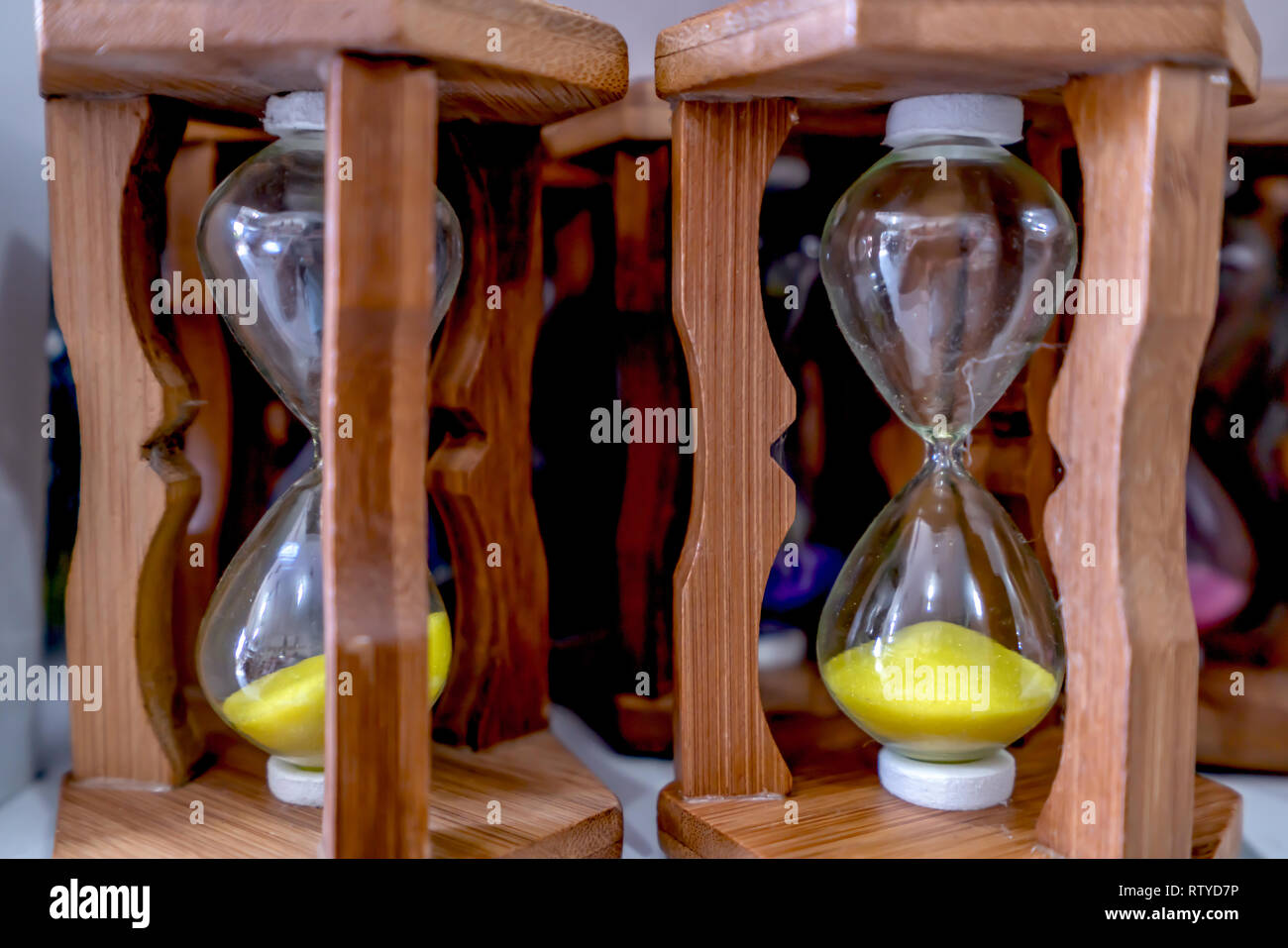 Glass hourglass, device used to measure the passage of time Stock Photo