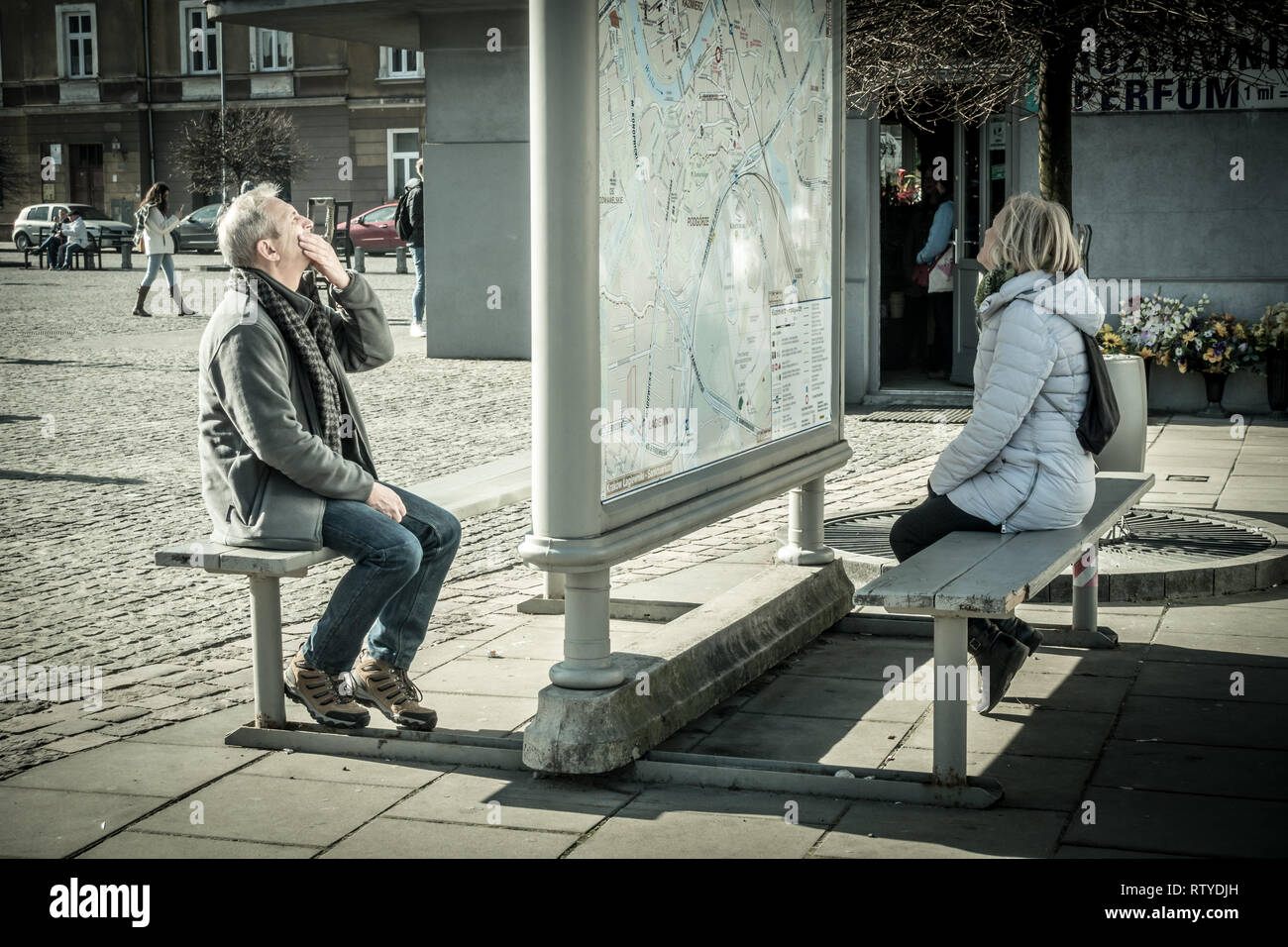 People studying a map in Krakow Poland Stock Photo