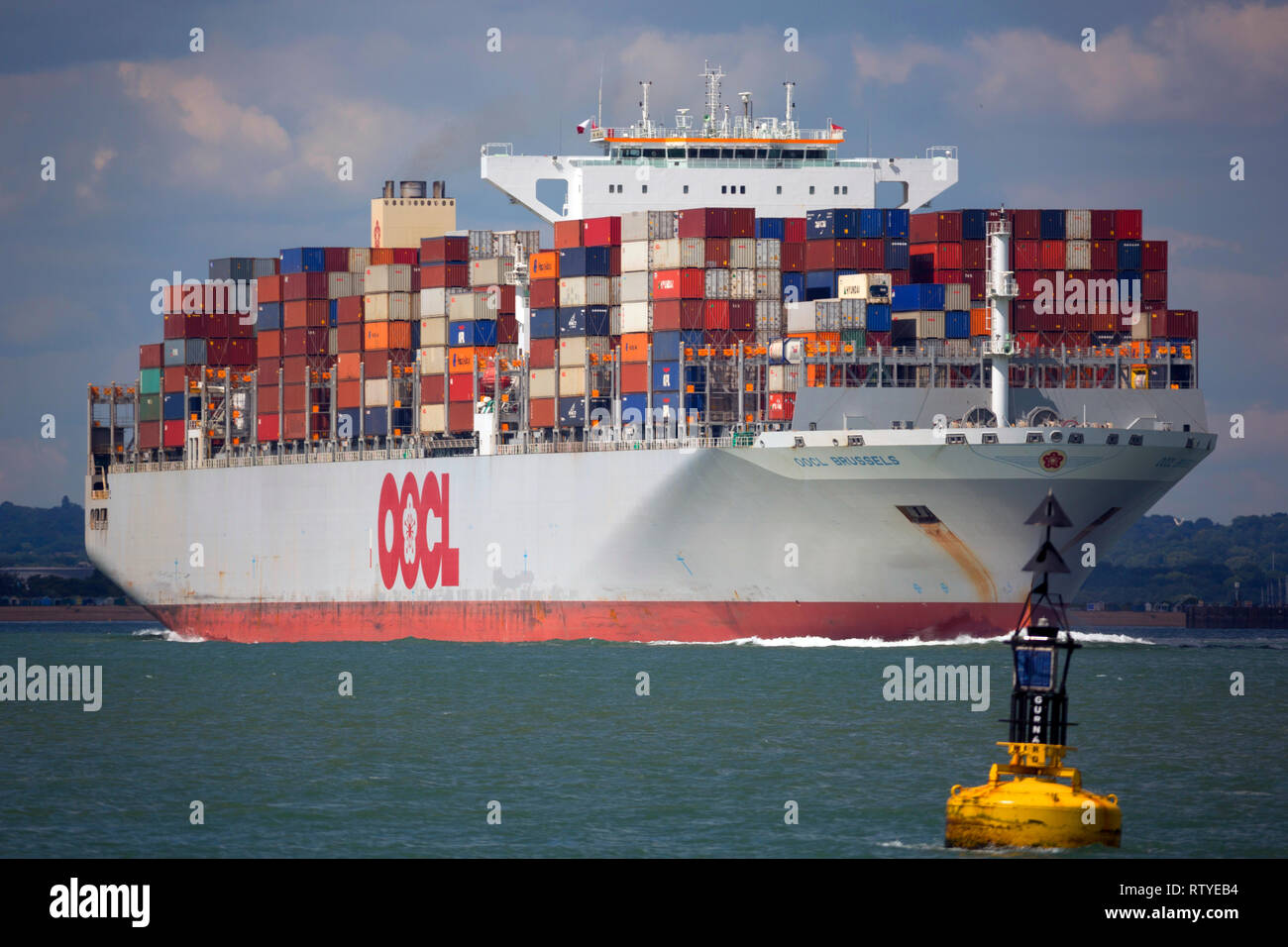 Brexit, lite,empty,Close up,OOCL, Container Ship, leaving, Southampton, Port, The Solent, Cowes, Isle of Wight, Stock Photo