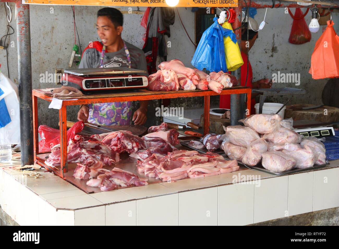 EL NIDO, PHILIPPINES DECEMBER 2, 2017 Man sells meat at a food