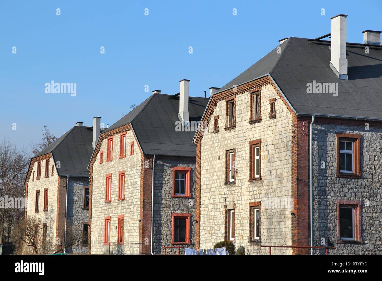 Czeladz, Poland - apartment buildings in Piaski district. Traditional Silesian architecture called 'familok'. Stock Photo