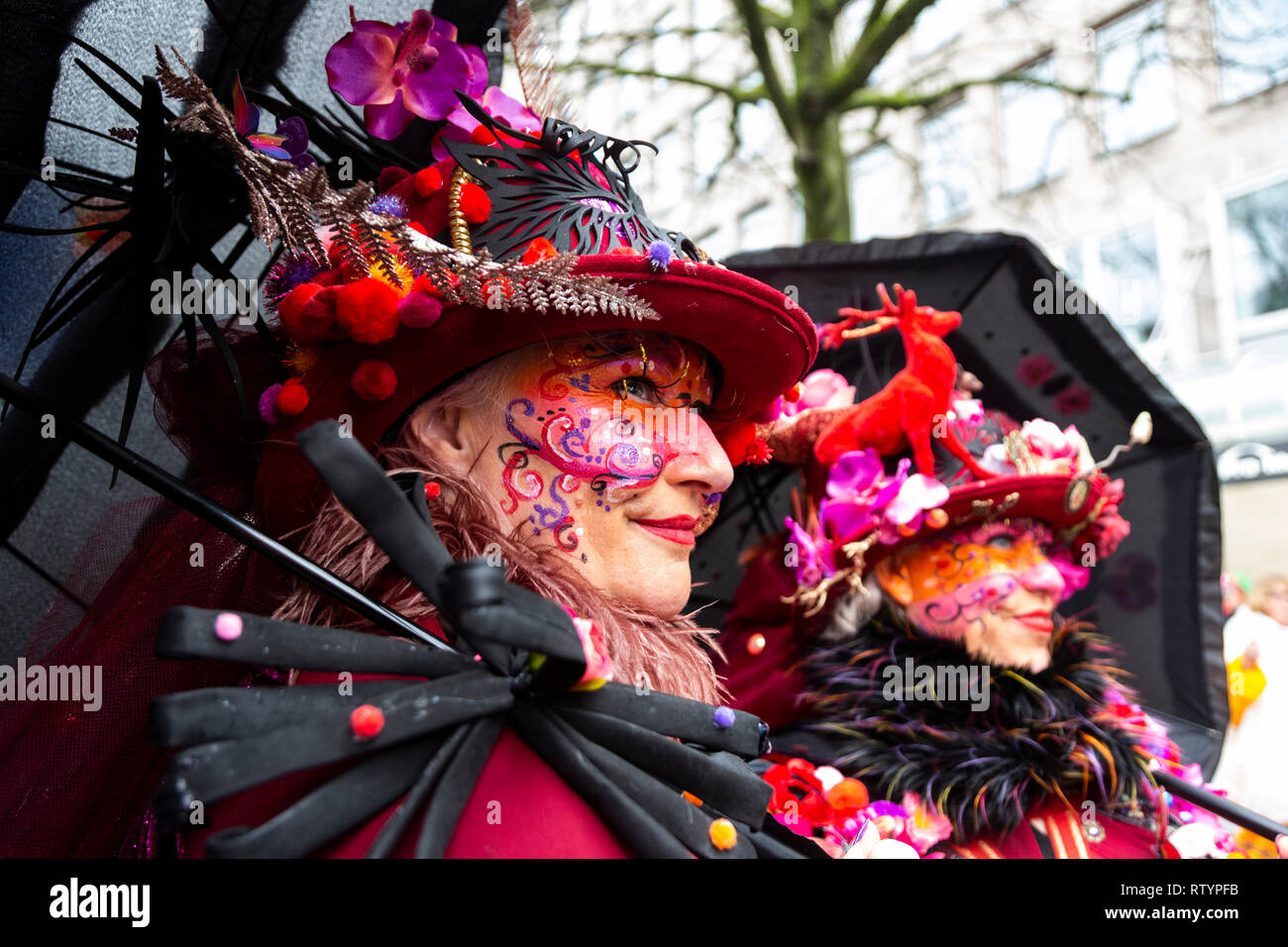 Dusseldorf, Germany. 3 March 2019. Colourful costumes are on display at the traditional Kö-Treiben even on Dusseldorf's Königsallee ahead of the traditional carnival parades on Rose Monday (Shrove Monday). The parades in the Rhineland are in doubt because of the forecast storms. Credit: Vibrant Pictures/Alamy Live News Stock Photo