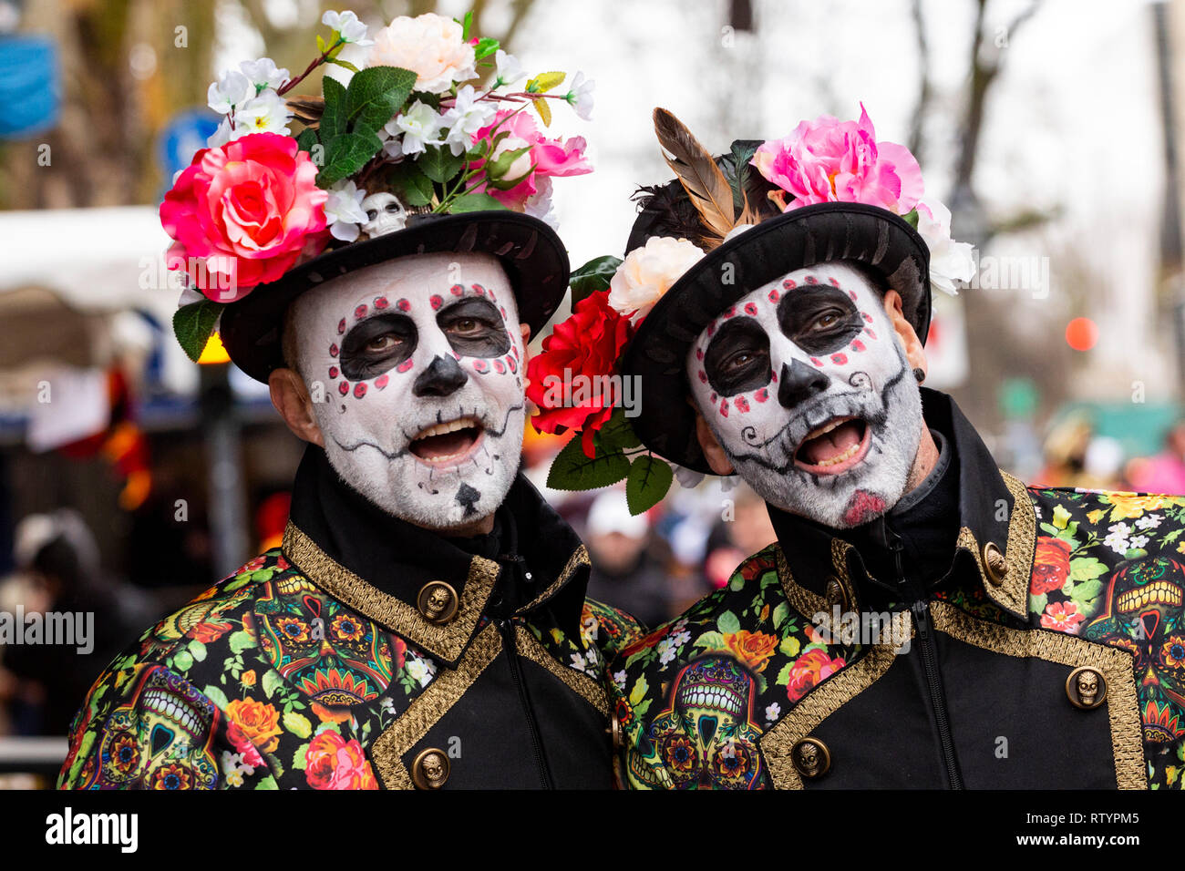 Dusseldorf, Germany. 3 March 2019. Colourful costumes are on display at the traditional Kö-Treiben even on Dusseldorf's Königsallee ahead of the traditional carnival parades on Rose Monday (Shrove Monday). The parades in the Rhineland are in doubt because of the forecast storms. Credit: Vibrant Pictures/Alamy Live News Stock Photo
