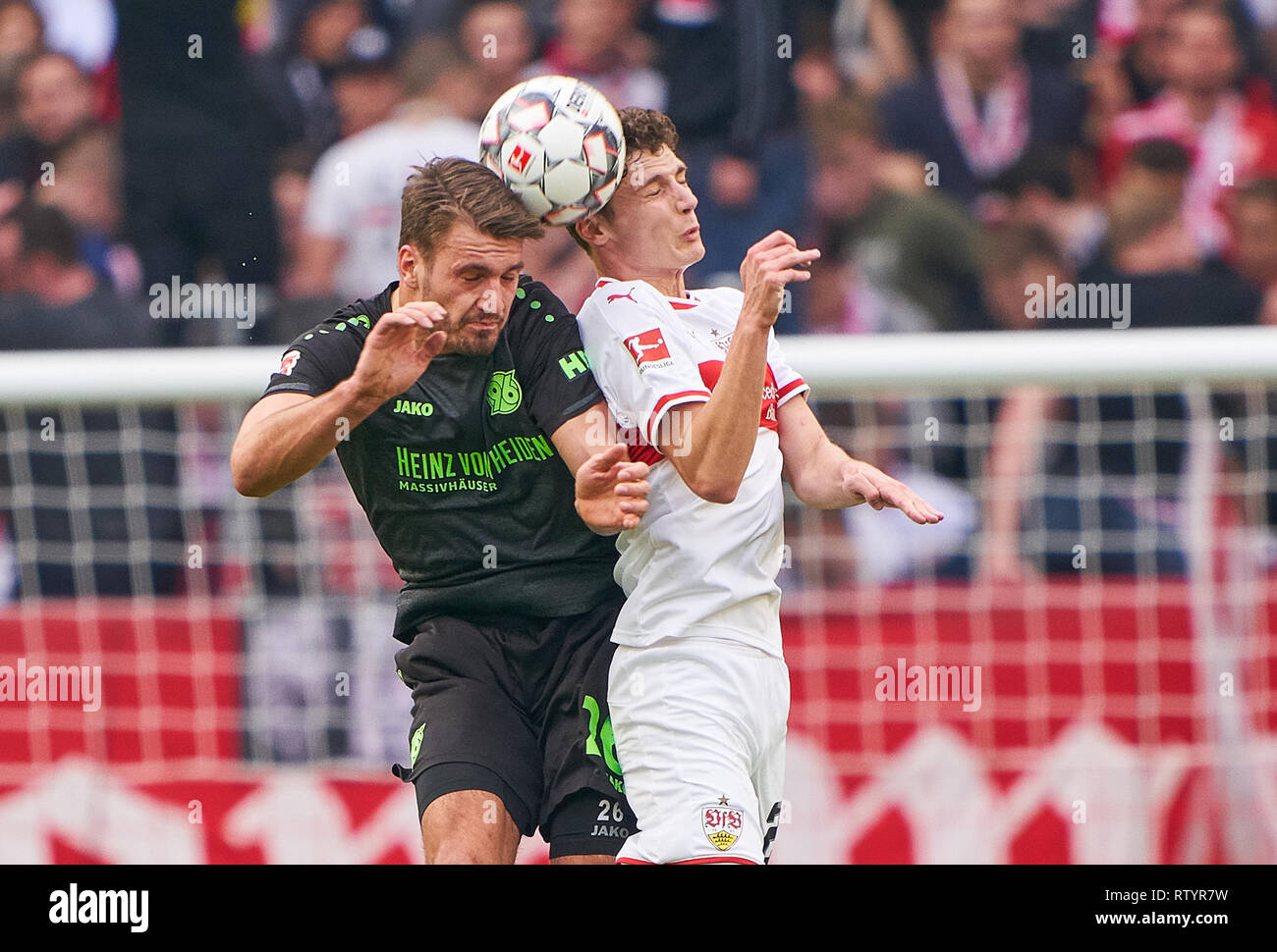 Stuttgart, Germany . 03rd Mar, 2019. Benjamin PAVARD, VFB 21  compete for the ball, tackling, duel, header, action, fight against Hendrik WEYDANDT, H96 26  VFB STUTTGART - HANNOVER 96  - DFL REGULATIONS PROHIBIT ANY USE OF PHOTOGRAPHS as IMAGE SEQUENCES and/or QUASI-VIDEO -  DFL 1.German Soccer League , Stuttgart, March 3, 2019,  Season 2018/2019, matchday 24, H96 Credit: Peter Schatz/Alamy Live News Stock Photo