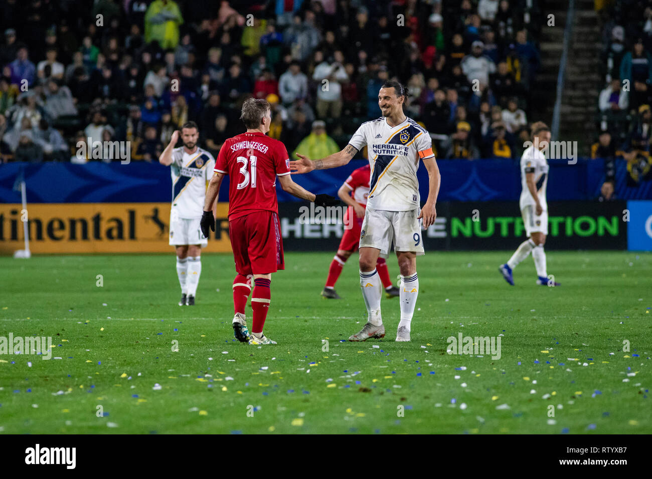 Carson, USA. 2nd March, 2019. Zlatan Ibrahimonic (9) and Bastian Schweinsteiger (31) show some love during the second half of their 2019 MLS season opener. Credit: Ben Nichols/Alamy Live News Stock Photo