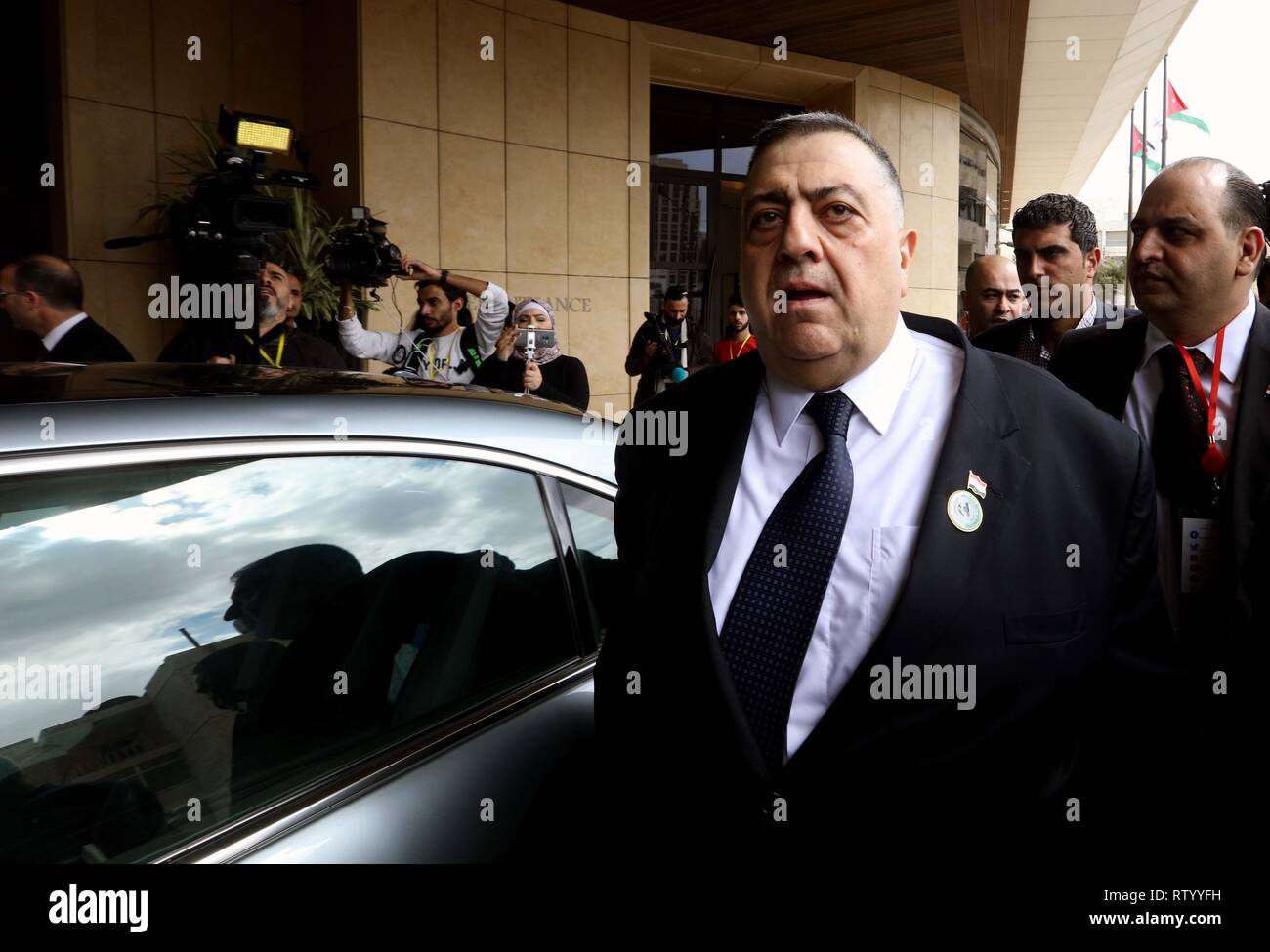 Amman, Jordan. 3rd Mar, 2019. Speaker of Syrian People's Assembly Hammoudeh Sabbagh (Front) arrives for the opening of the 29th conference of the Arab Inter-Parliamentary Union (AIPU) in Amman, Jordan, on March 3, 2019. Hammoudeh Sabbagh representing Syria attended the meeting for the first time since the country's conflict broke out in 2011. Credit: Mohammad Abu Ghosh/Xinhua/Alamy Live News Stock Photo