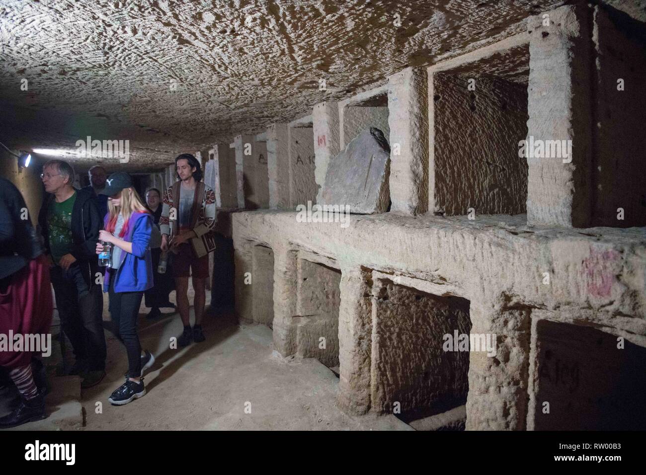 Alexandria, Egypt. 3rd Mar, 2019. People visit the catacombs of ancient Kom al-Shoqafa tombs in the northern seaside Alexandria province, Egypt, on March 3, 2019. The Egyptian Ministry of Antiquities celebrated on Sunday the completion of a project removing underground water from 2,000-year-old catacombs in the northern seaside province of Alexandria dating back to the Greco-Roman era. Credit: Wu Huiwo/Xinhua/Alamy Live News Stock Photo
