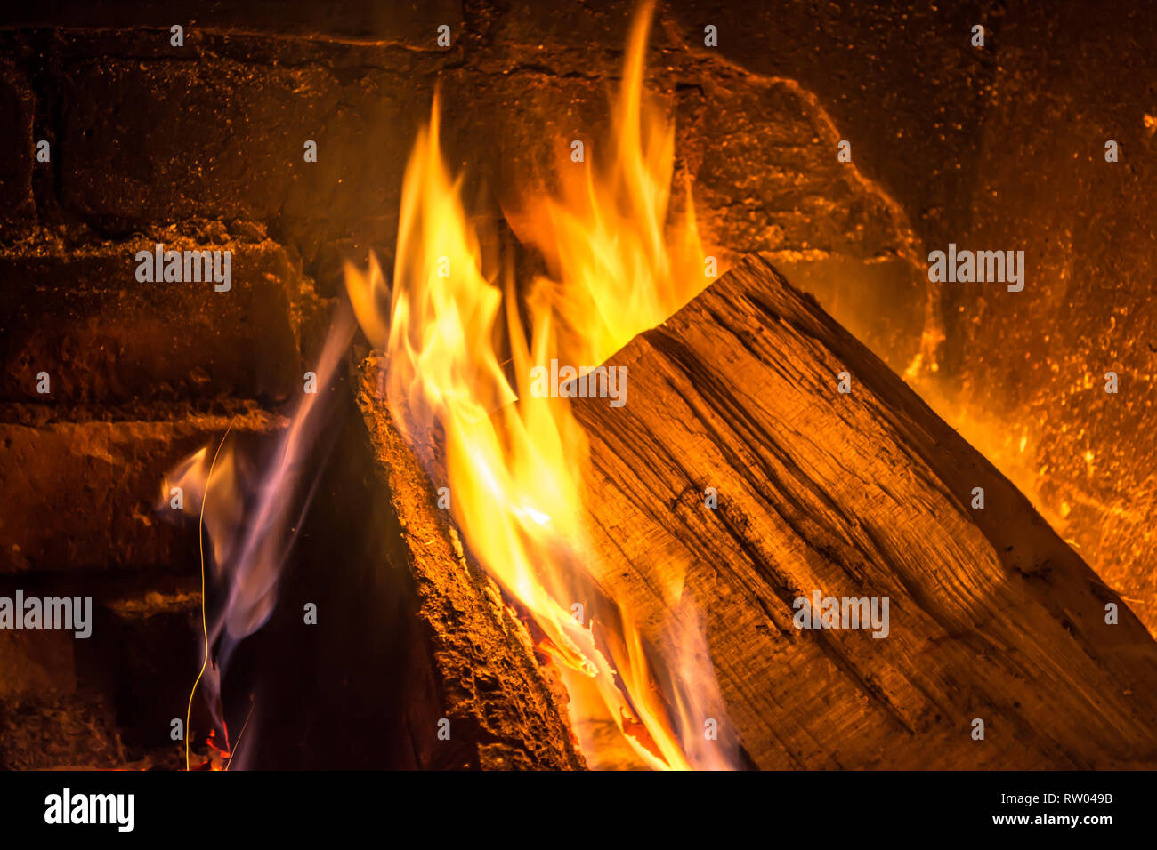 Firewood burning in an old fireplace close up Stock Photo Alamy