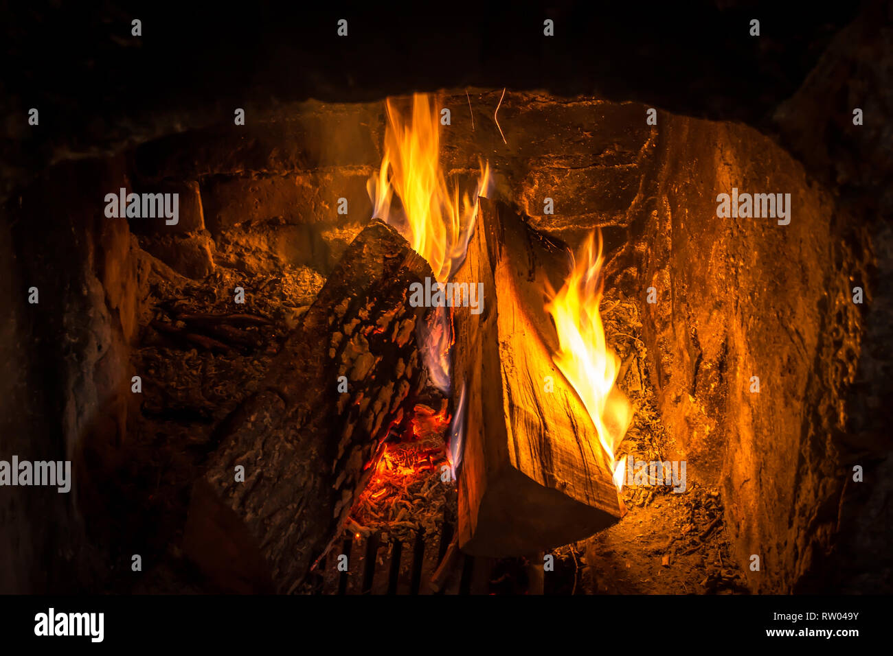Firewood Burning In An Old Fireplace Close Up Stock Photo
