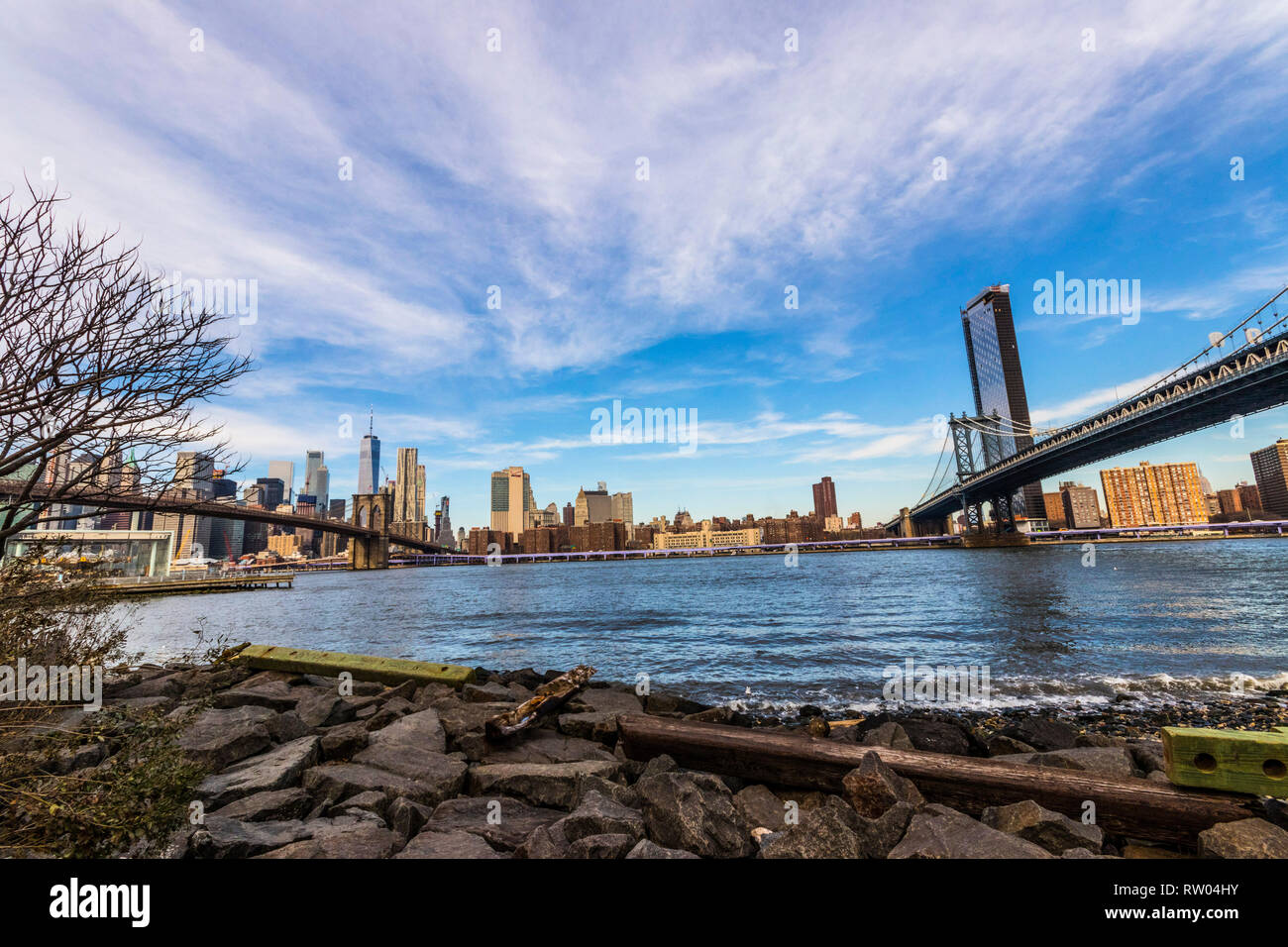 Wide angle panoramic view of East River, Brooklyn Bridge and Manhattan ...