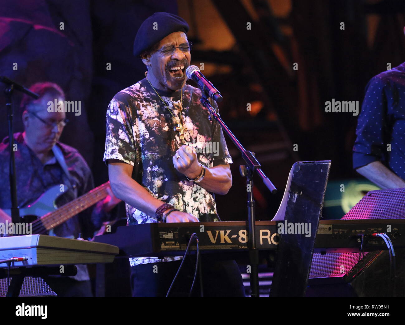 Musician Leroy 'Lonnie' Jordan is shown performing on star during a 'live' concert appearance with War. Stock Photo