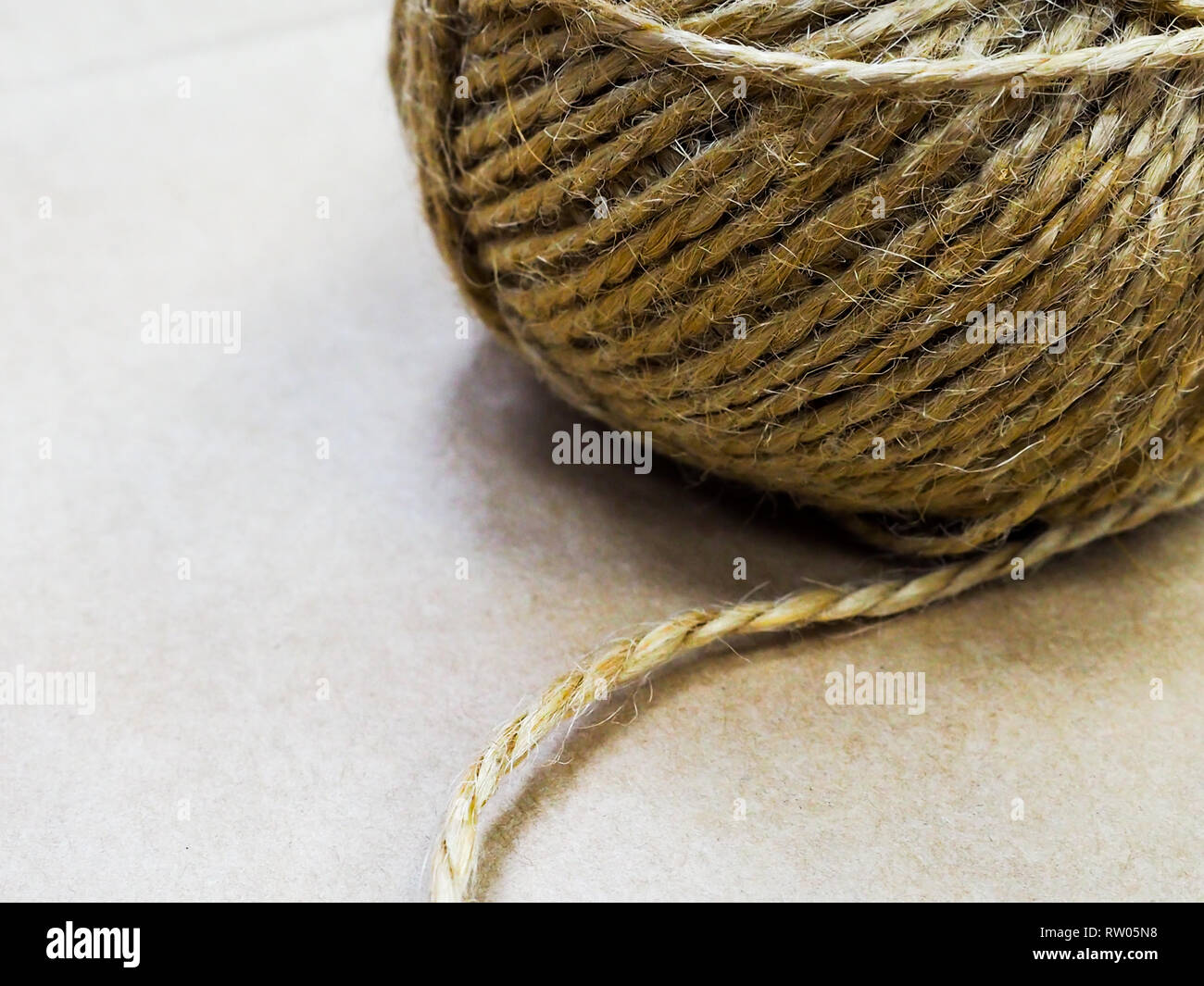 Natural Jute Twine Roll, top view on white wood background. DIY Wrap Gift  Hemp Rope Cord String Roll, supplies and tools for handmade hobby leisure  Stock Photo - Alamy