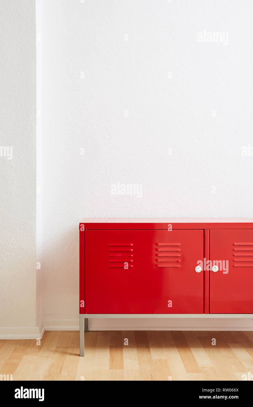 red locker white wall wooden floor in vivid light Stock Photo - Alamy