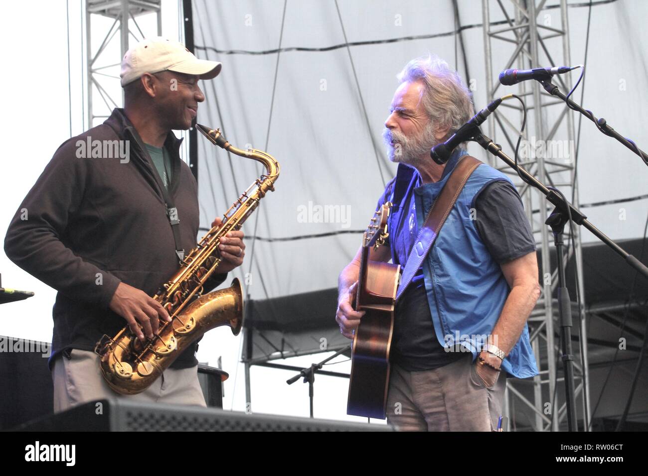 Musicians Branford Marsalis and Bob Weir shown performing on stage during a live concert appearance with Bruce Hornsby. Stock Photo