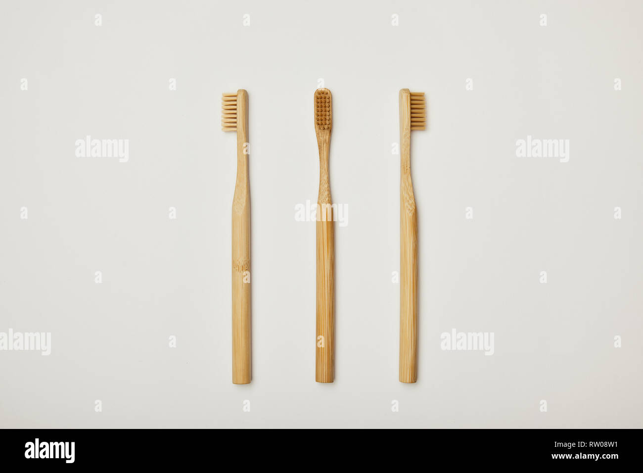 top view of bamboo toothbrushes on white background Stock Photo - Alamy