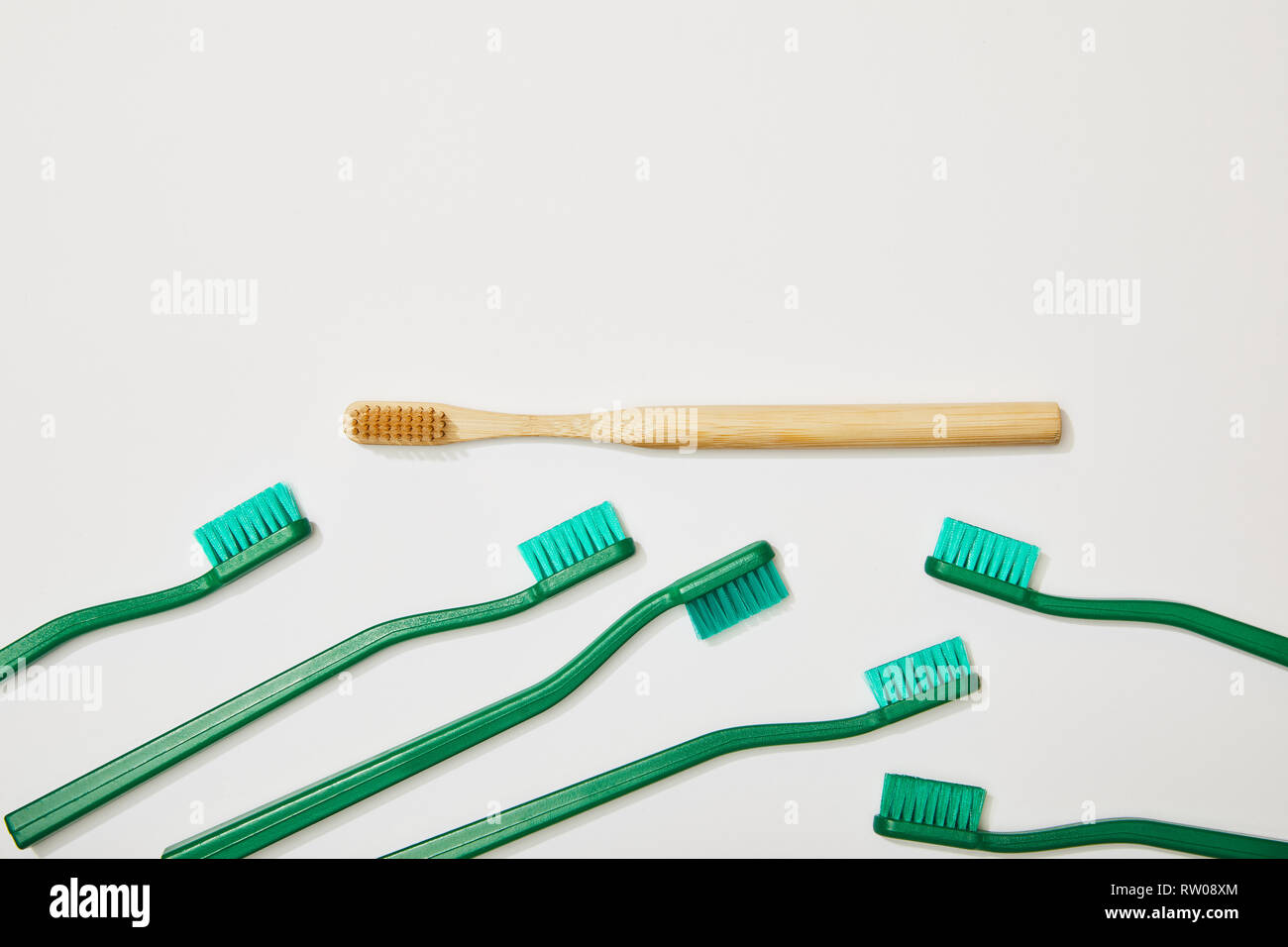 top view of plastic and bamboo toothbrushes on white background Stock ...