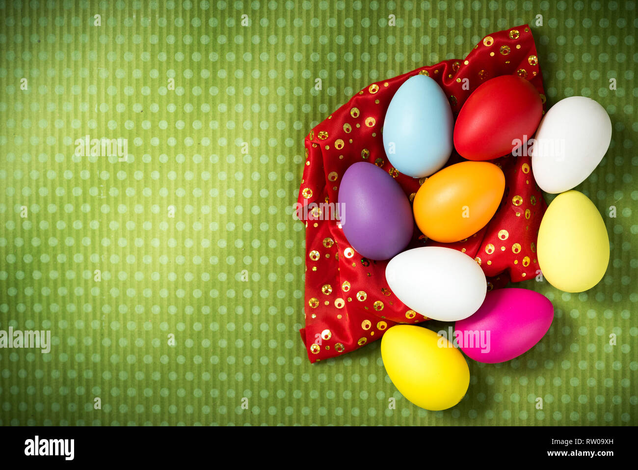 Easter eggs on a beautiful green background in white peas. Festive background. Easter ideas. Space for text. Happy easter. Stock Photo