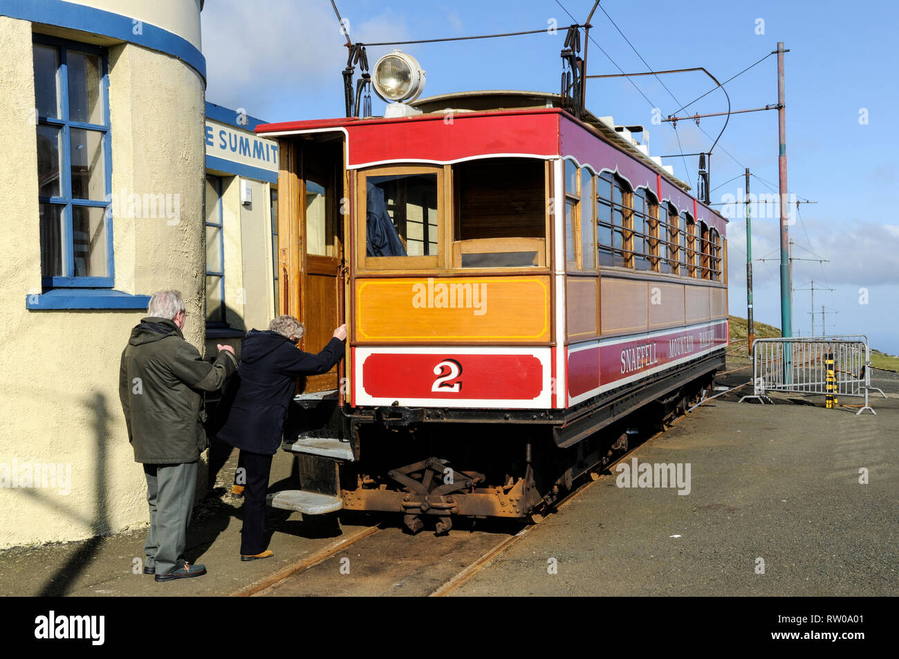 Passengers boarding the return journey on the wooden built Snaefell mountain electric powered railway tram at the end of the line at the Summit cafe o Stock Photo