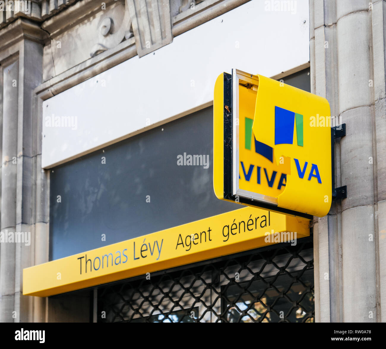 Strasbourg, France - Oct 1, 2017: Aviva insurance anget signage advertsing destroyed by vandals street view - Aviva is a British multinational insurance company Thomas Levy Agent General  Stock Photo