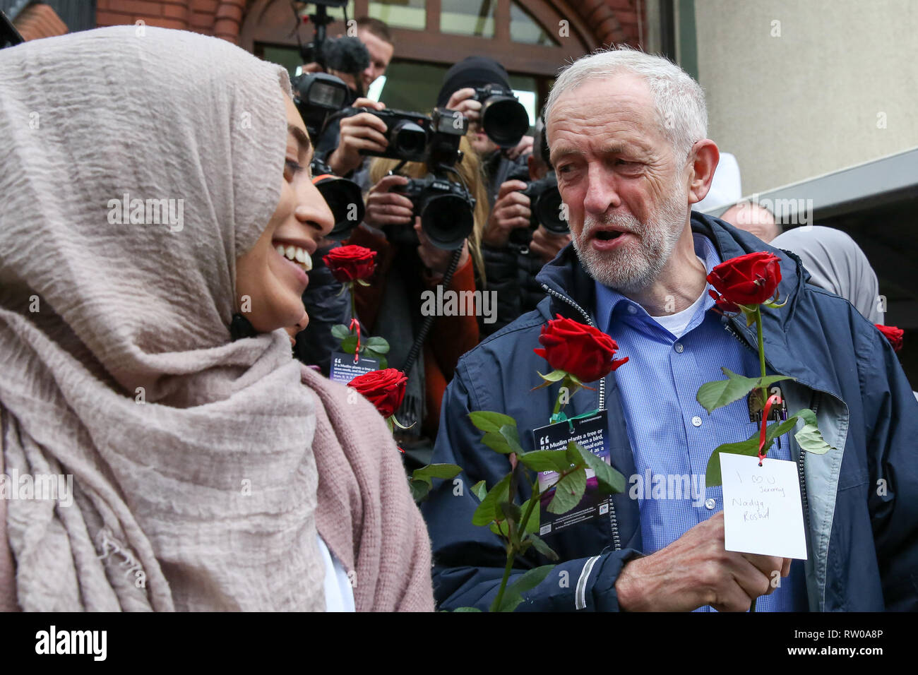 Labour leader Jeremy Corbyn is seen with flowers during the fourth Visit My Mosque Day at Finsbury Park Mosque in North London. Over 250 mosques open their doors to non-Muslim guests and visitors on the fourth Visit My Mosque Day. This year the national event also encourages mosques to support Keep Britain Tidy's Great British Spring Clean campaign with many already taking part in cleaning their communities. Later a man thought to be a pro-Brexit campaigner was arrested after he pressed down an egg on Jeremy Corbyn’s head. Stock Photo