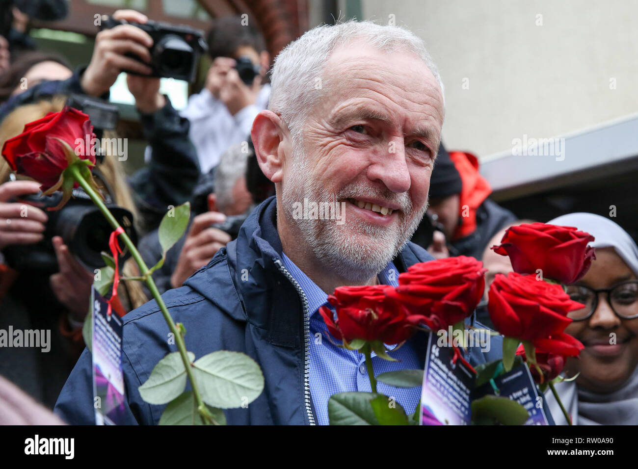 Labour leader Jeremy Corbyn is seen with flowers during the fourth Visit My Mosque Day at Finsbury Park Mosque in North London. Over 250 mosques open their doors to non-Muslim guests and visitors on the fourth Visit My Mosque Day. This year the national event also encourages mosques to support Keep Britain Tidy's Great British Spring Clean campaign with many already taking part in cleaning their communities. Later a man thought to be a pro-Brexit campaigner was arrested after he pressed down an egg on Jeremy Corbyn’s head. Stock Photo
