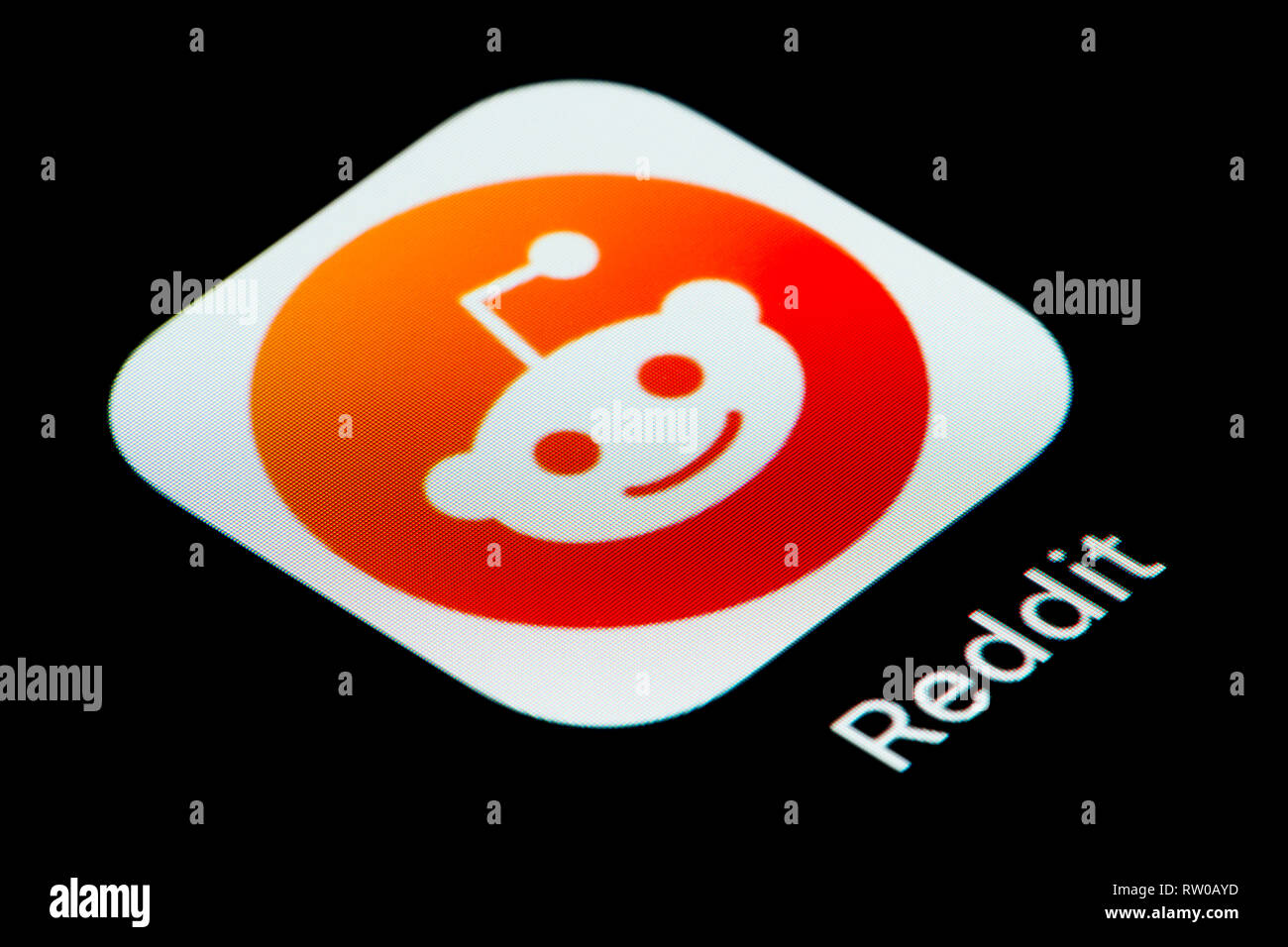 A Close Up Shot Of The Reddit App Icon As Seen On The Screen Of A