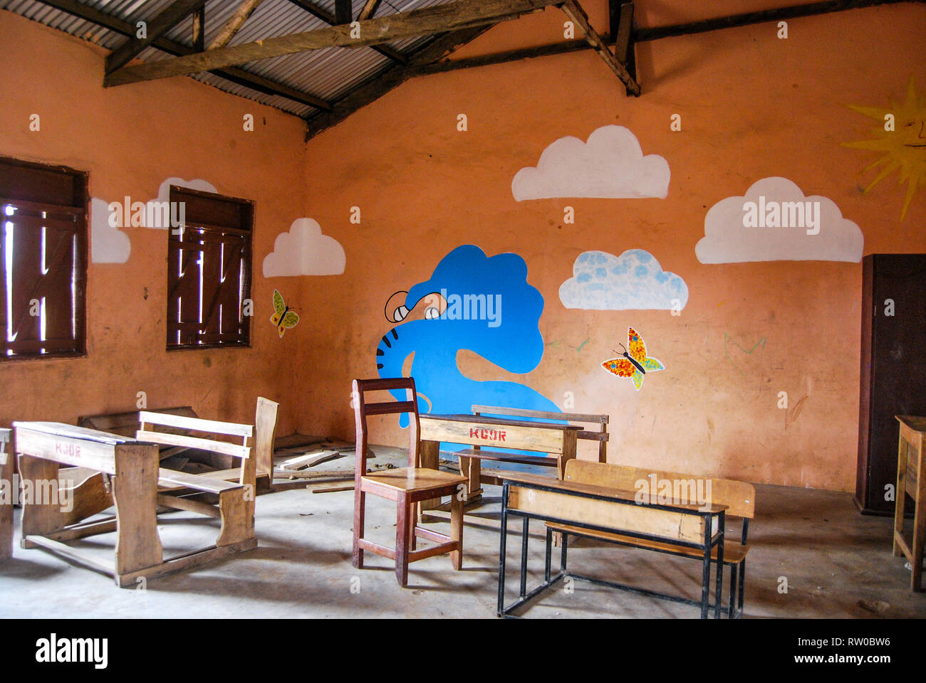 A nice photo of a beautiful blue elephant painted on a brown wall of a classroom of a local elementary school in Kongo village, Ghana. Stock Photo