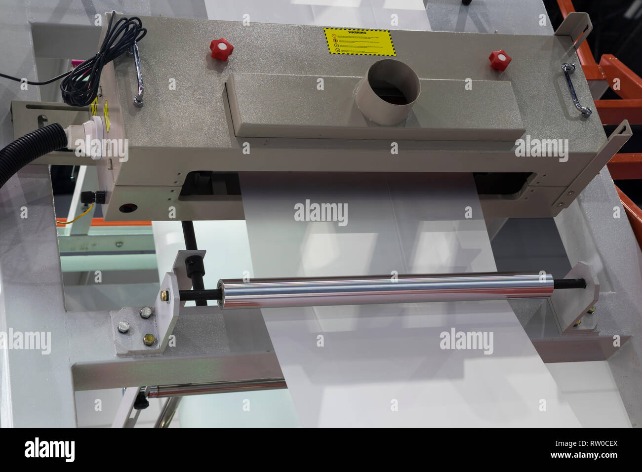 Winding unit of extrusion plastic film blowing machine ; close up Stock Photo