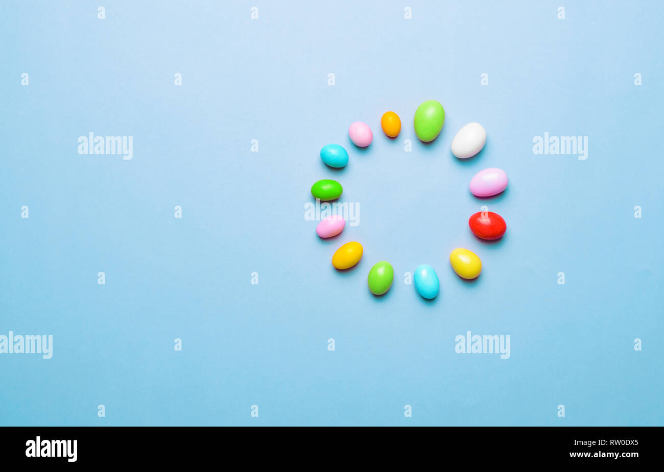 Easter Is Loading, Chocolate Eggs on Bright Background, Festive Easter Concept Stock Photo