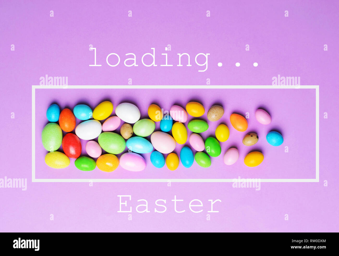 Easter Is Loading, Chocolate Eggs on Bright Background, Festive Easter Concept Stock Photo