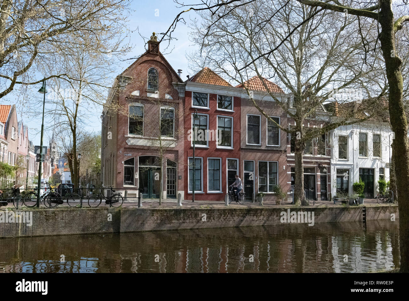 Netherlands, Gouda, 2017, cyclist passing in front of traditional