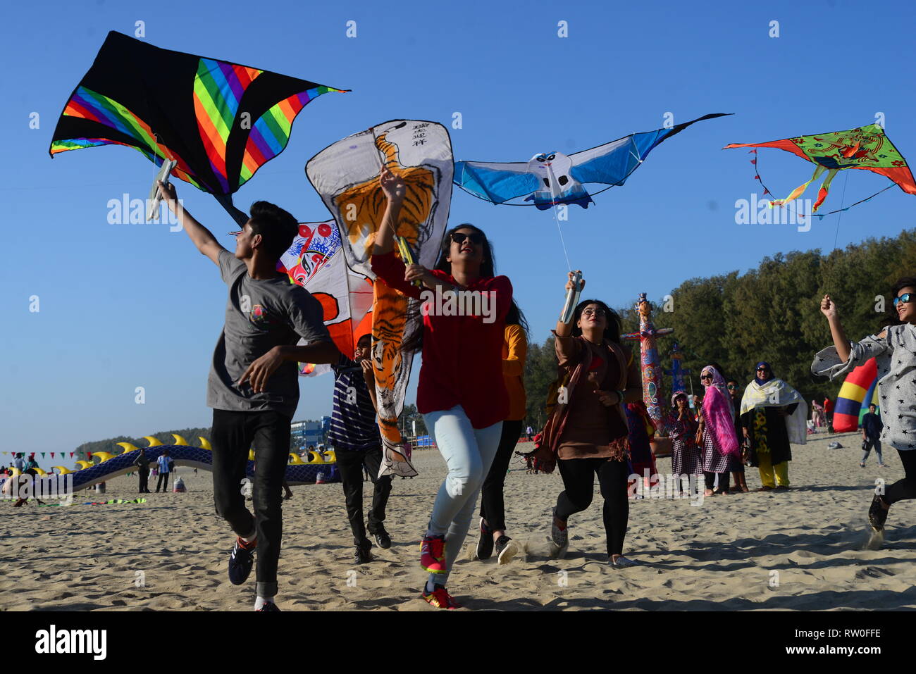 Participant flying colorful kites on the Kite Festival event in Coxs