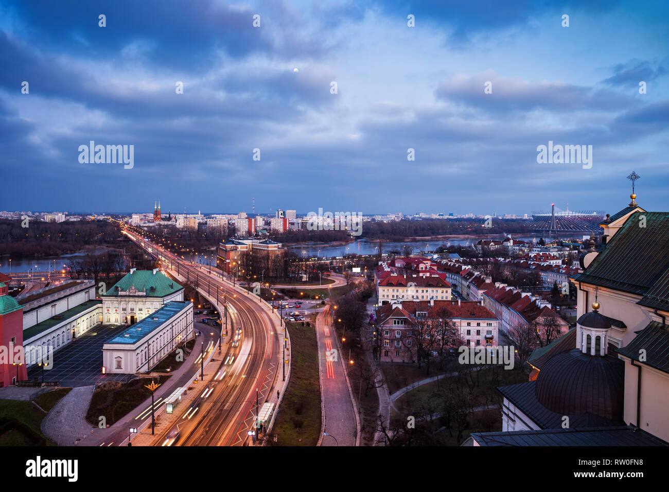 City of Warsaw evening cityscape, capital of Poland, Solidarity Avenue (Solidarnosci), view from downtown to river Stock Photo