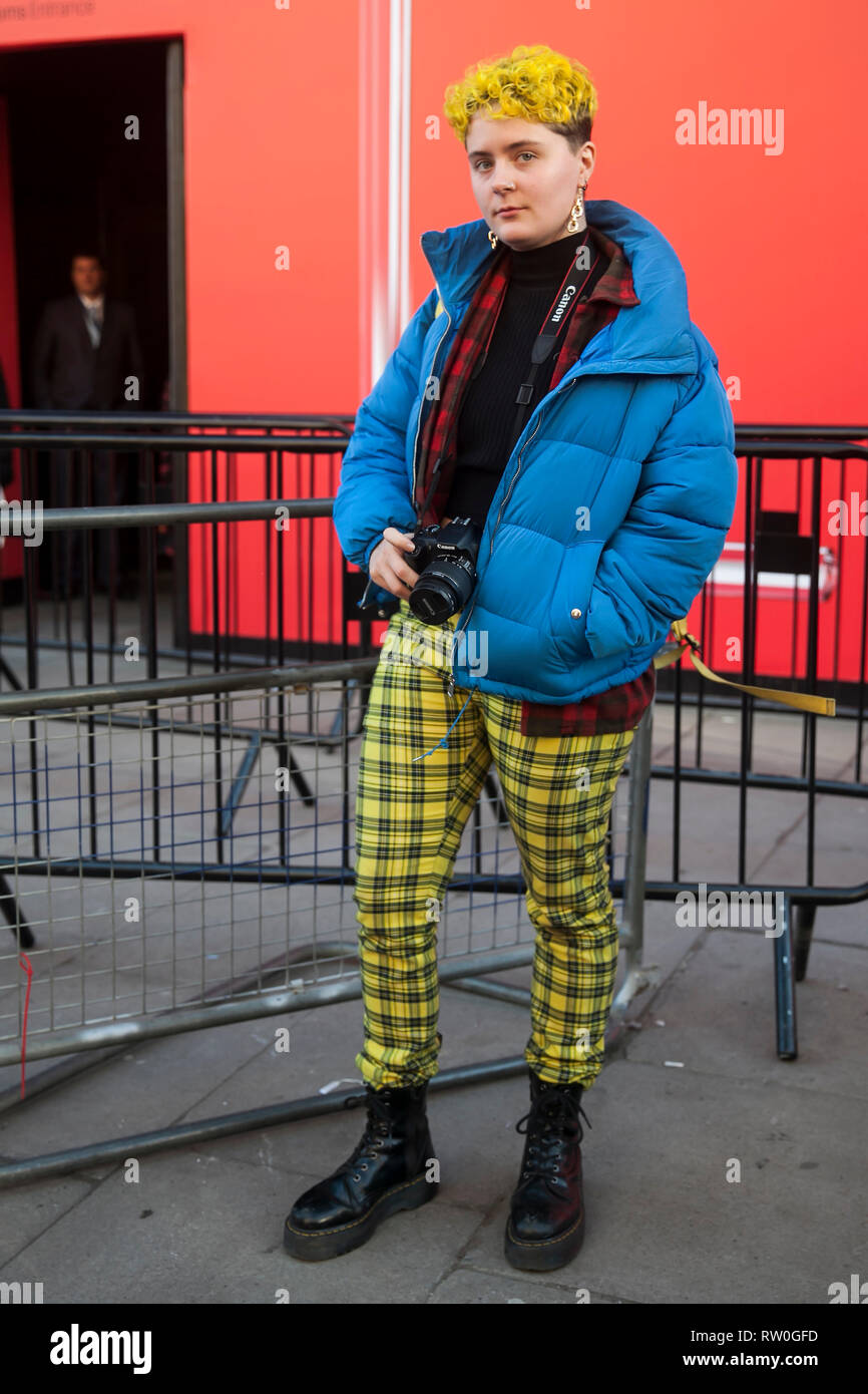 LONDON - FEBRUARY 15, 2019: . A guest is seen in a red plaid shirt