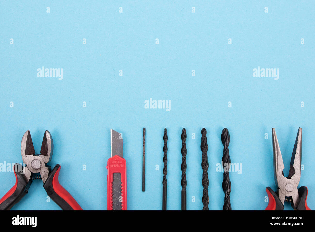 Tools Background Blue Set of different tools on blue background Stock Photo - Alamy
