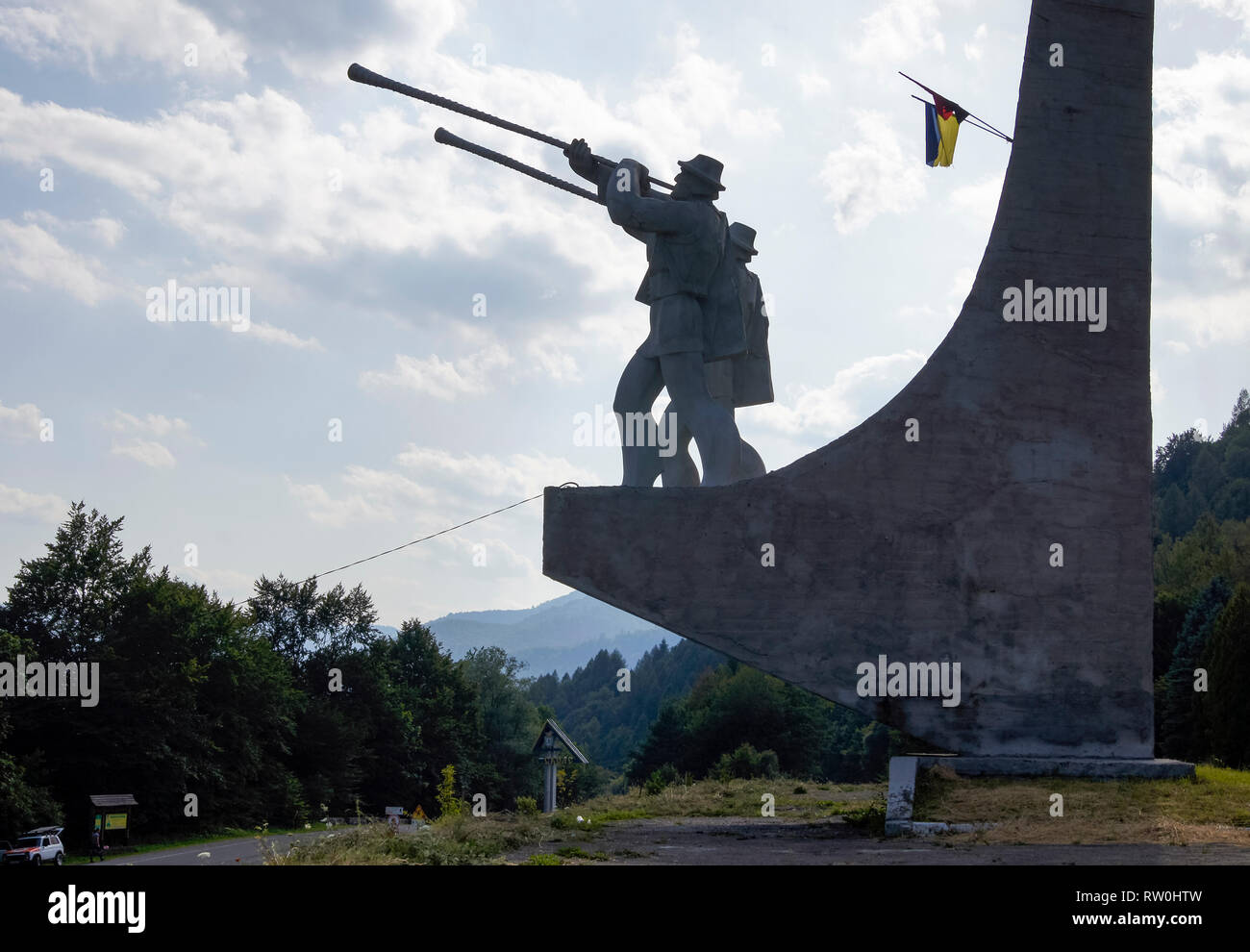 Monument in Skole and Ukrainian flag in the Skole Beskids National Park. Ukraine, Europe Stock Photo