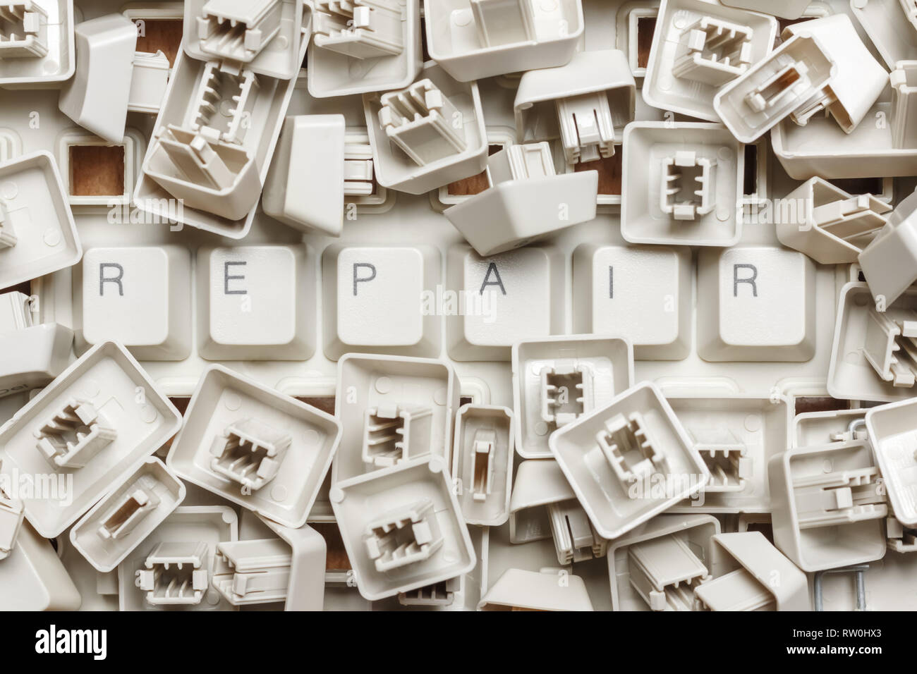 The word repair from a pile of computer keys Stock Photo
