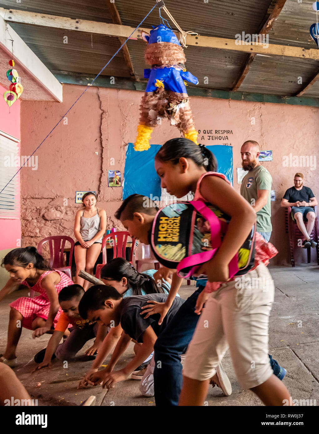 Latin Children At Birthday Party Running After Candy Out Of A Pinata In Guatemala Stock Photo Alamy